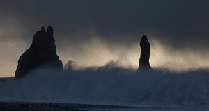 Black Sand Beach, in the vicinity of Vik, in the southern shores of Iceland, is a beautiful beach whose sands are volcanic in origin. The weather can be calm or wild and tempestuous as in this early morning winter photograph.